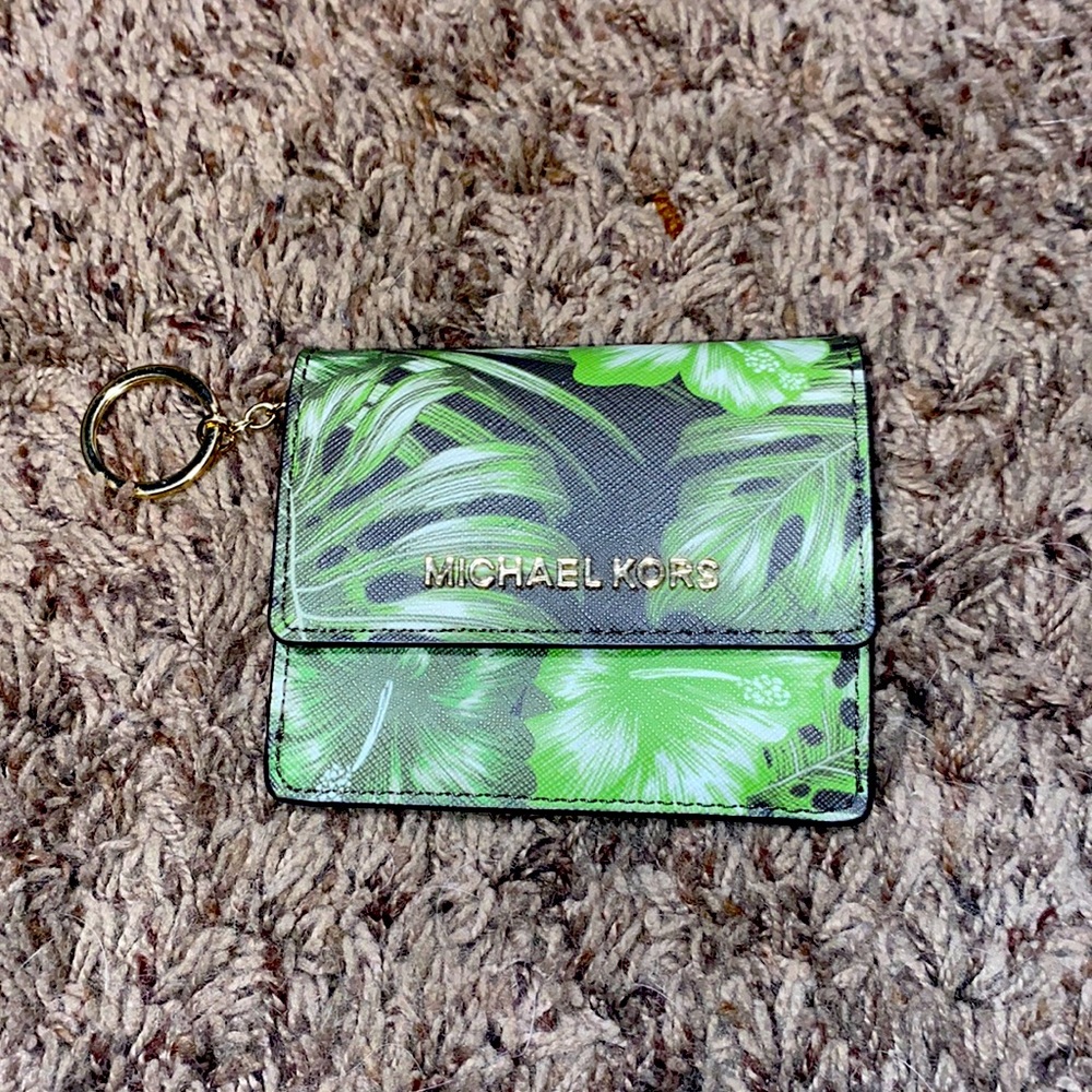 A small Michael Kors keychain wallet.